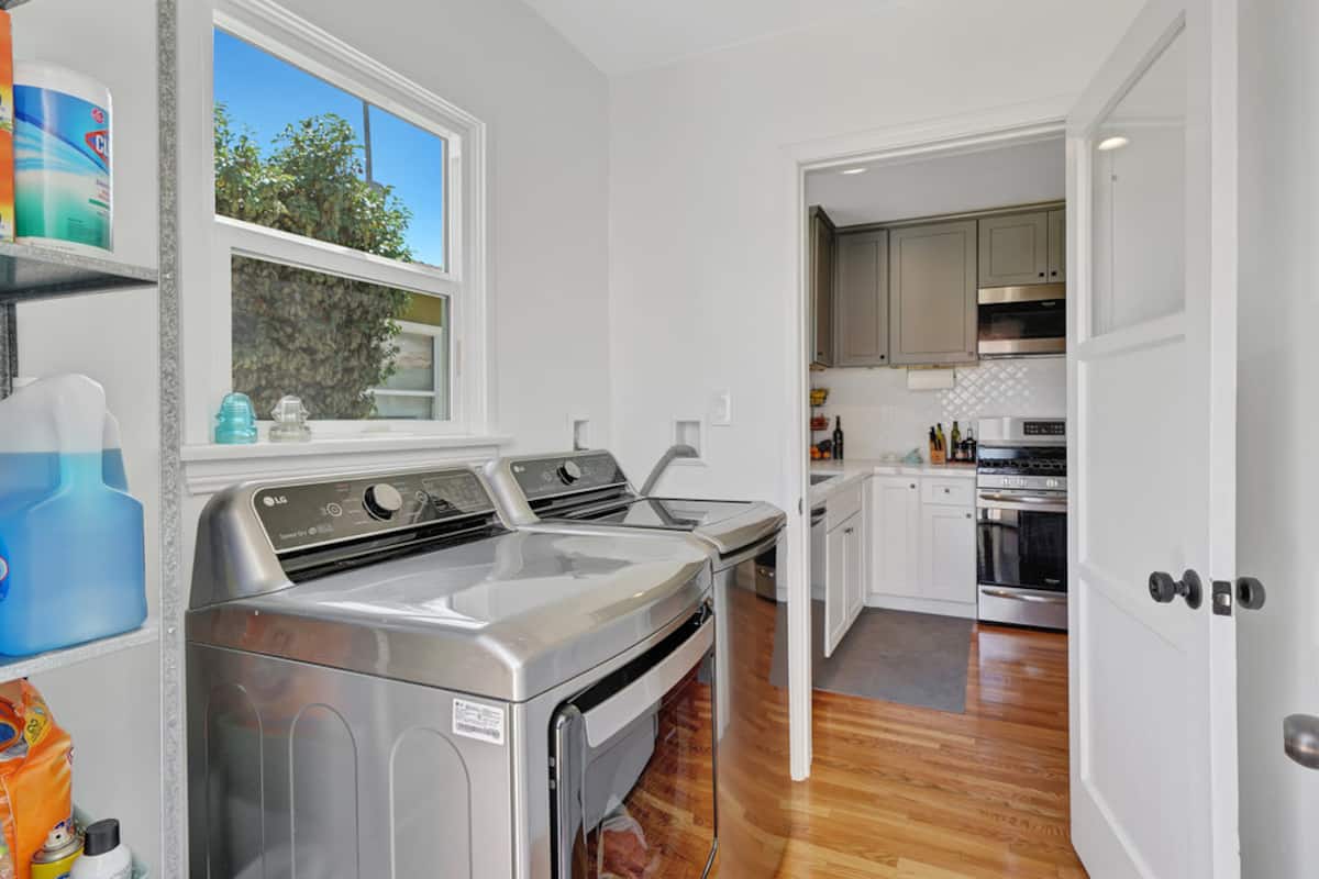 The in-unit washer and dryer beside a sunny window